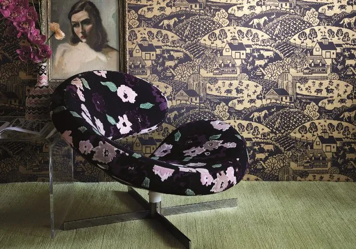 modern chair in a room with an amazing wallpaper